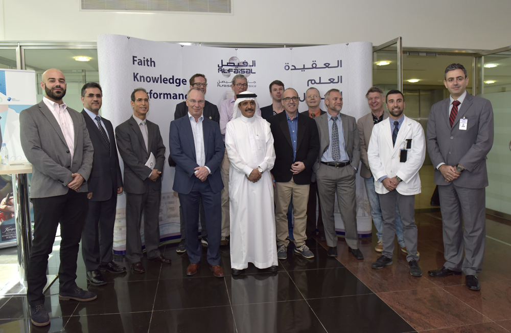 President HE Dr.Mohamed Alhayaza and Dean Nouredine Zettili pose with the KFIP winners